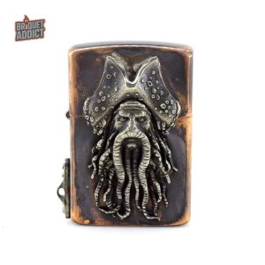 Ancien briquet en cuivre au design original